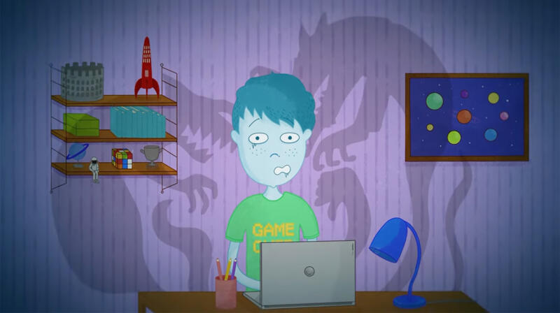 Scen från animerad film med en pojke som sitter framför en dator och känner sig rädd.