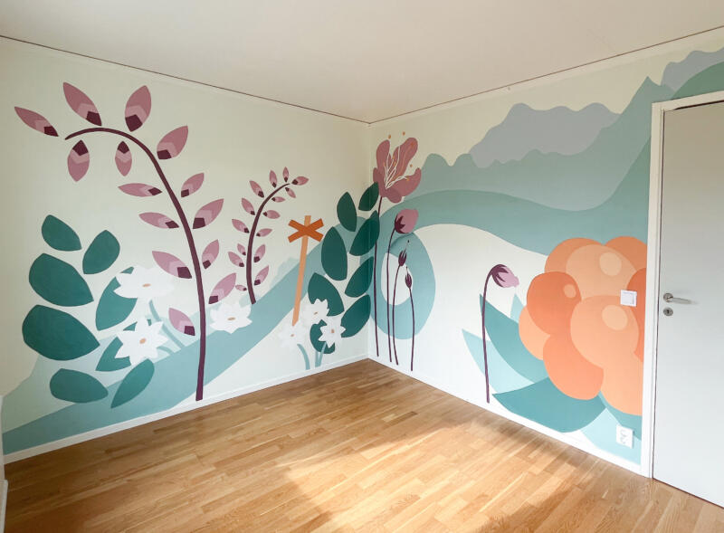 Mural of nordic mountain range. A coludberry and native flowers.