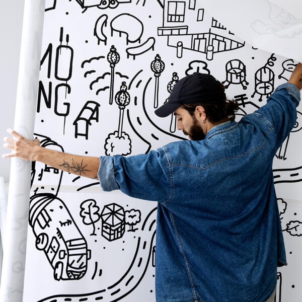 Artist Skinny Gonzales with canvas for Malmö in the making