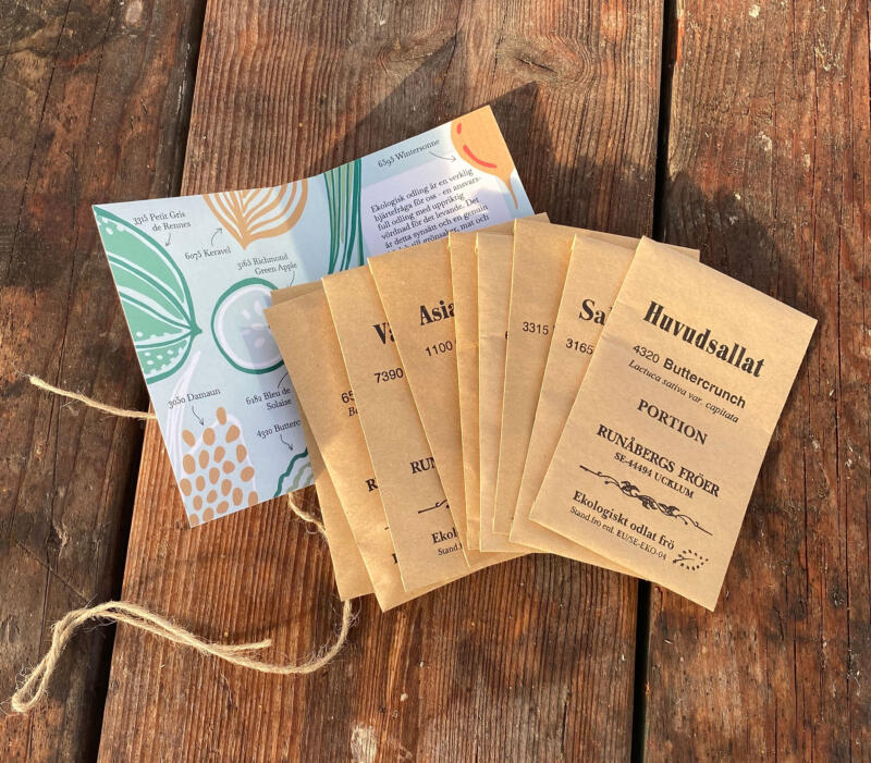 Illustrationer på grönsaker som valts ut av Lotta Lundgren, satta på en förpackning som omsluter fröpåsar