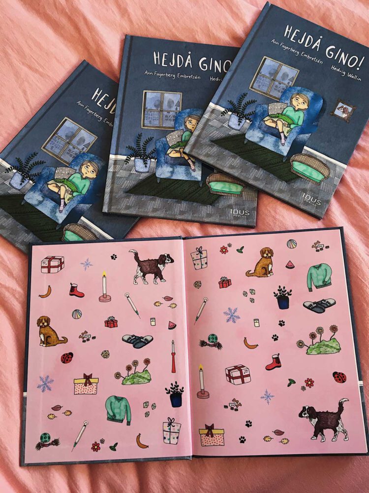 Detaljerat försättsblad / mönstersida i barnboken med illustration av hundar, paket, hundleksaker, en spruta, korv, växter, ljus m.m