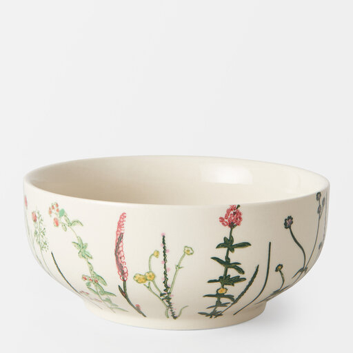 Vit skål med mönster av blommor på rad