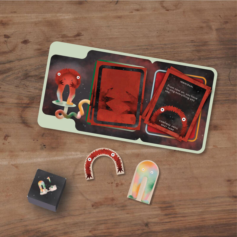 Boardgame pieces showing cards, a board, dice and the two characters of the game