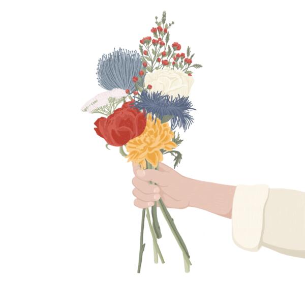 Hand som håller en vildväxt blombukett