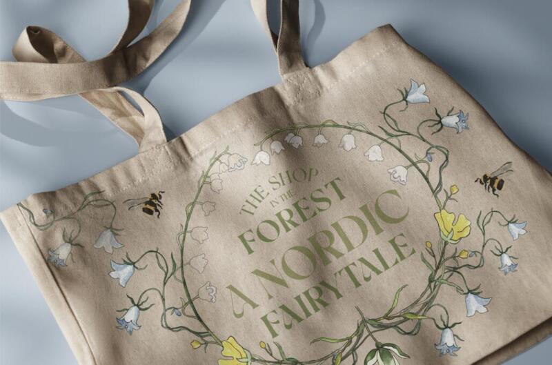 Tygväska med en botanisk illustration och grafisk design 