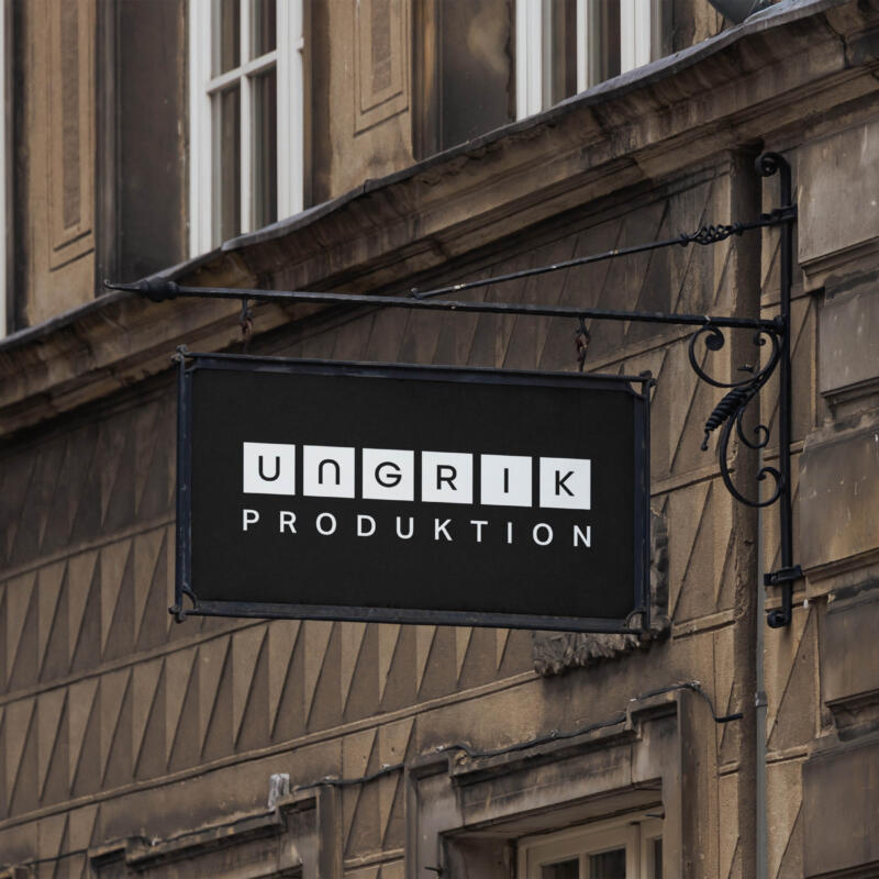 Ljus logotyp placerad på gatuskylt