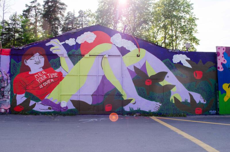 Mural of a woman with a satifyer, with a shirt saying 'Men, your time is over'