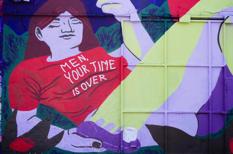 Mural of a woman with a satifyer, with a shirt saying 'Men, your time is over'