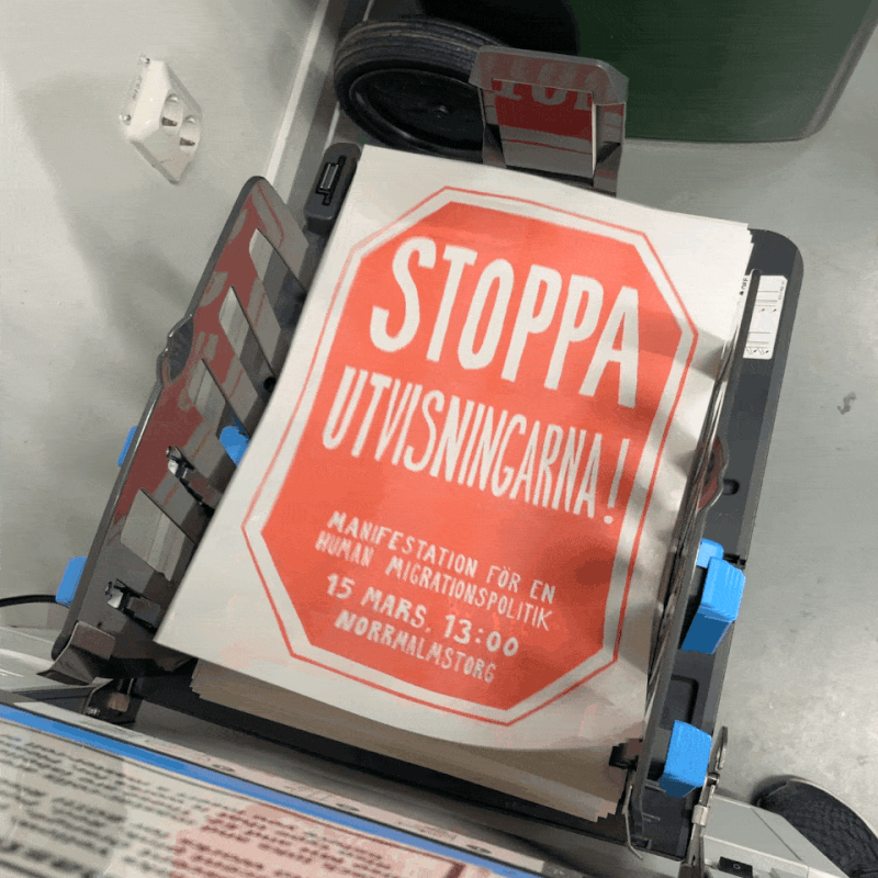 looping video of the printed posters flying out of the printer.