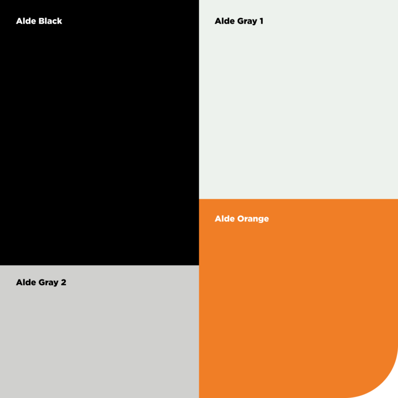 Aldes färgpalett i svart, grått, ljust grågrönt och orange.